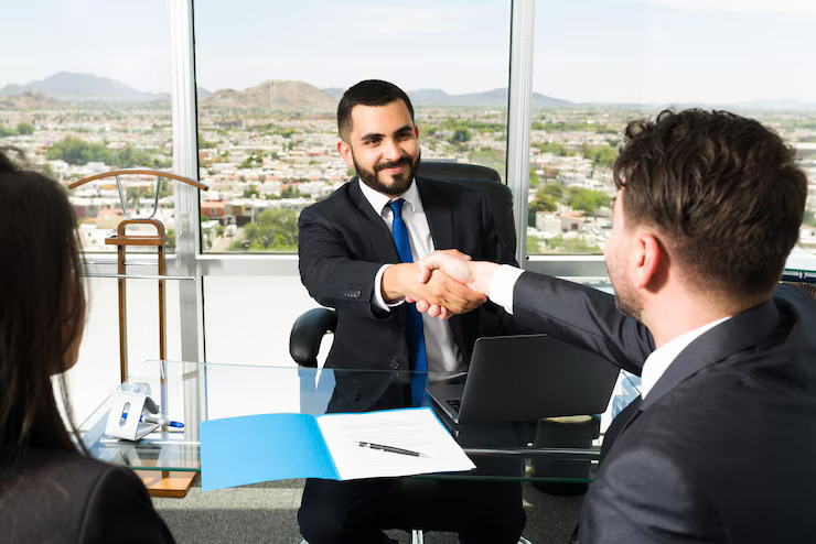 businessman-shaking-hands-with-company-executive-after-making-lucrative-business-deal-smiling-sales-representative-making-successful-sale_662251-293